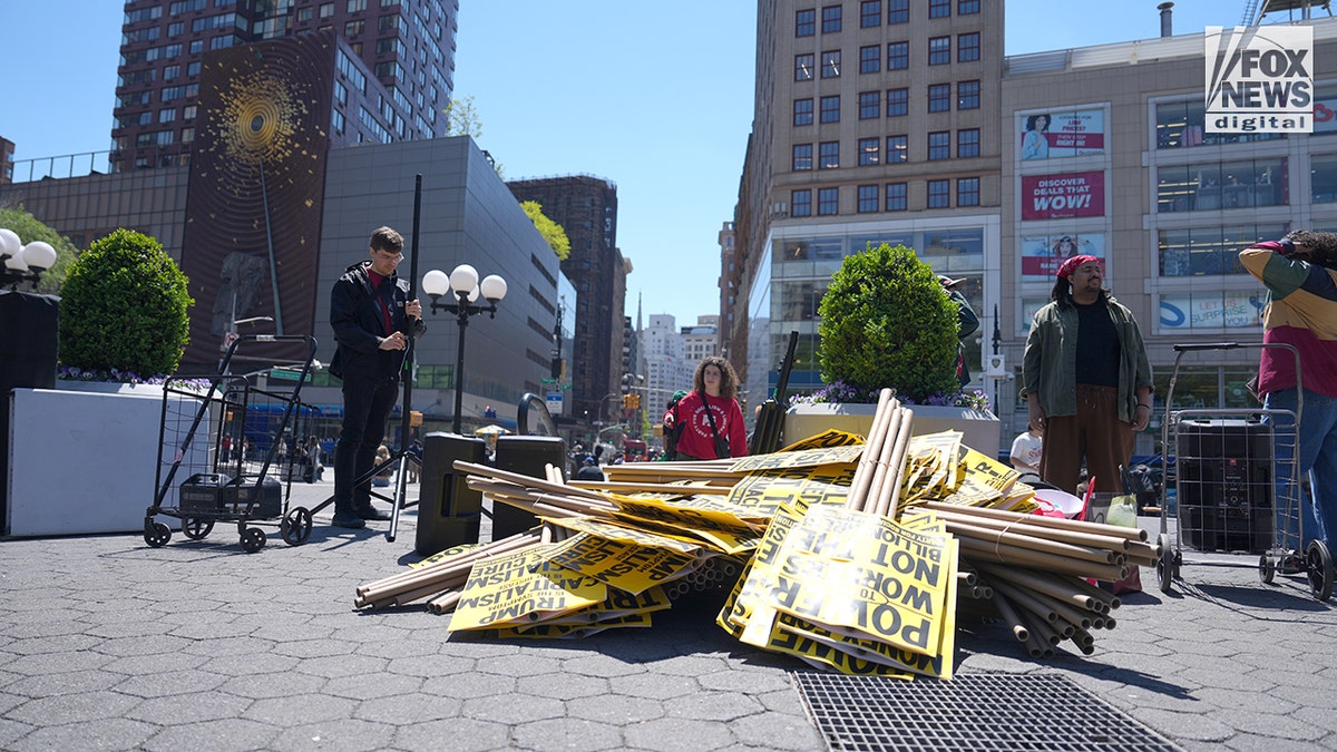 Activists prepare signs ahead of a May Day march in New York City on May 1, 2026.