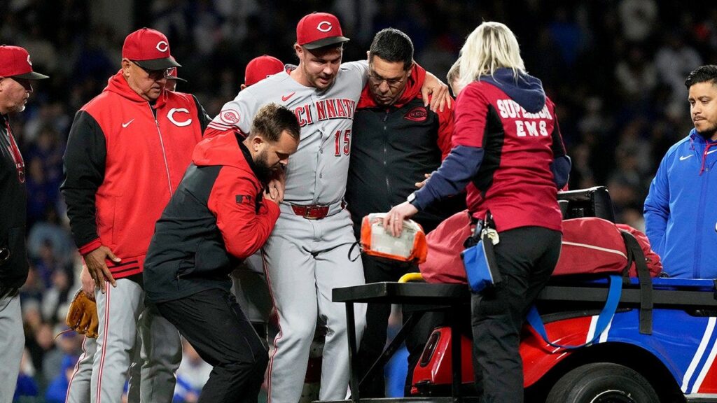 Reds closer carted off field after sustaining leg injury just one pitch into appearance