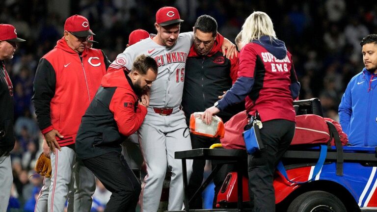 Reds closer carted off field after sustaining leg injury just one pitch into appearance