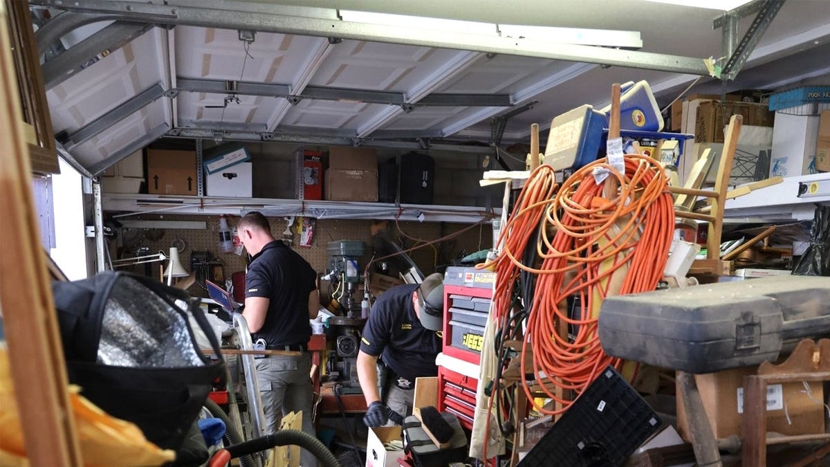Investigators at a house
