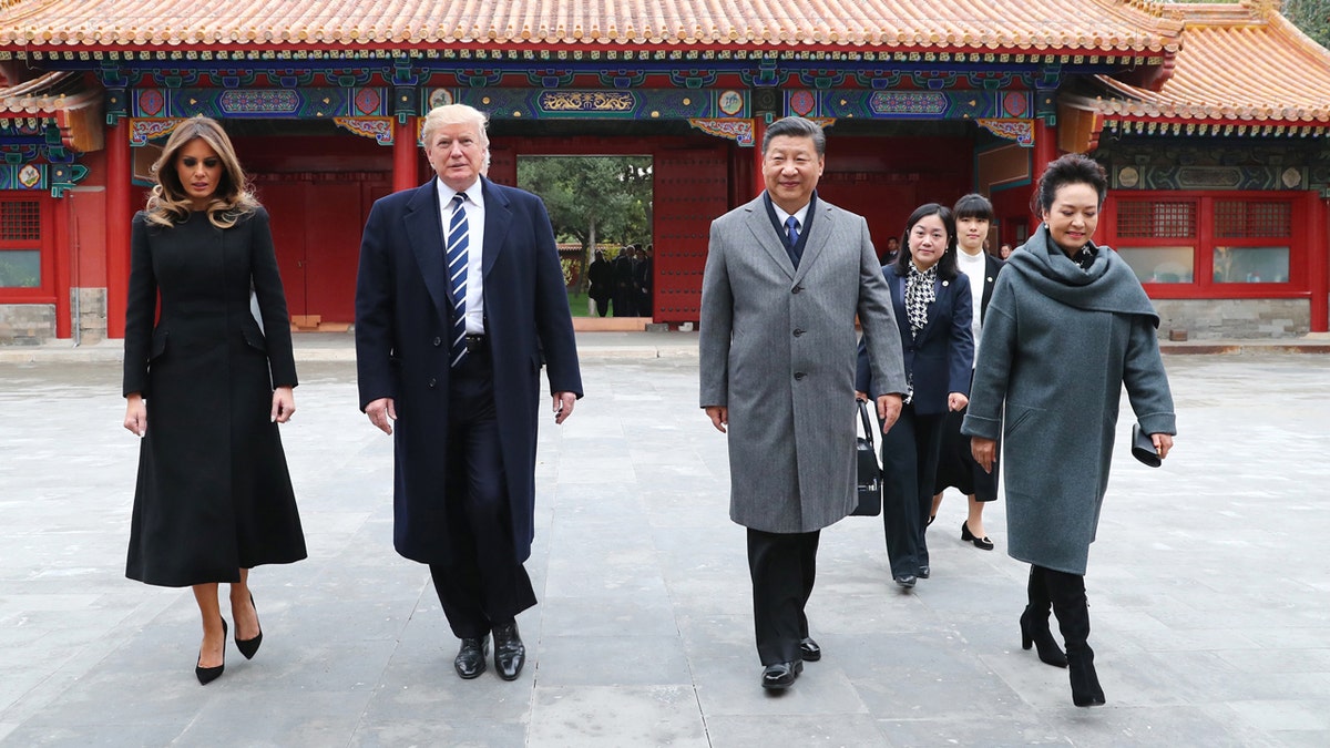 Chinese President Xi Jinping and wife Peng Liyuan welcome U.S. President Donald Trump and wife Melania Trump at the Forbidden City in Beijing