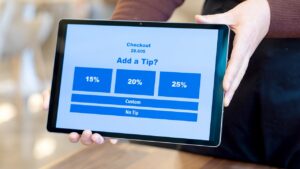 Automatic tipping programs spark concern as restaurants prepare for flood of visitors