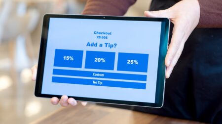 Automatic tipping programs spark concern as restaurants prepare for flood of visitors