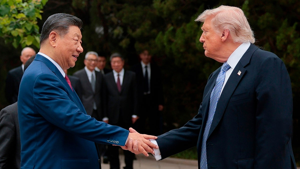 U.S. President Donald Trump shaking hands with Chinese President Xi Jinping in Beijing