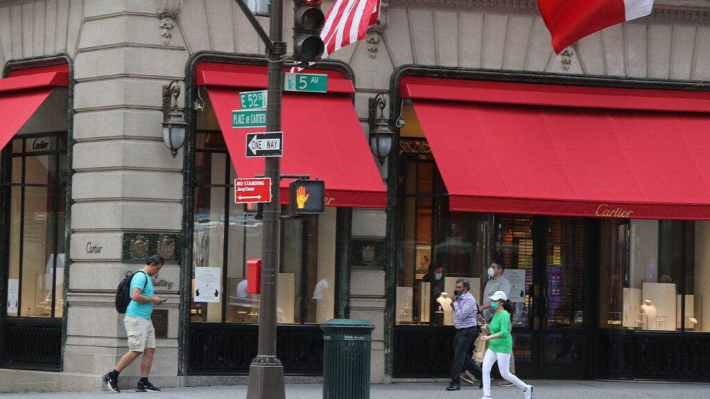 Woman dies after plunging into uncovered manhole outside luxury stores