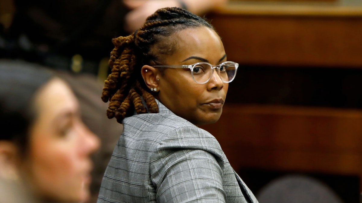 Ebony Parker looking back in a courtroom during Abby Zwerner's lawsuit in Newport News, Va.