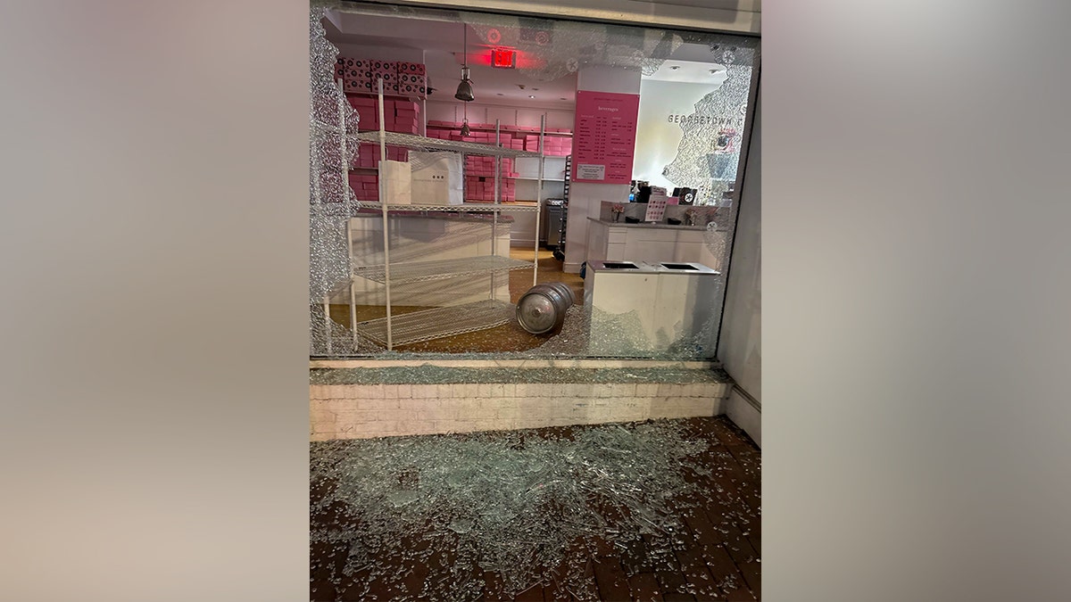 Georgetown Cupcake storefront with shattered front window and visible damage