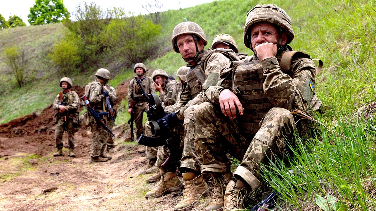 Newly recruited soldiers of Ukraine's 159th Separate Mechanized Brigade training at a military ground
