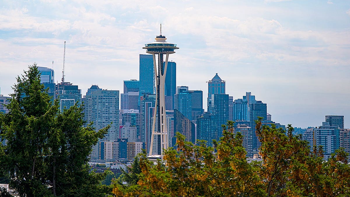 The Space Needle standing among downtown buildings in Seattle