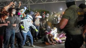 WATCH: Police absent from Delaney Hall chaos as agitators block ICE vehicles and agents use pepper spray