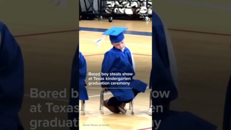 Bored boy steals show at Texas kindergarten graduation ceremony Bored boy steals show at Texas kindergarten graduation ceremony