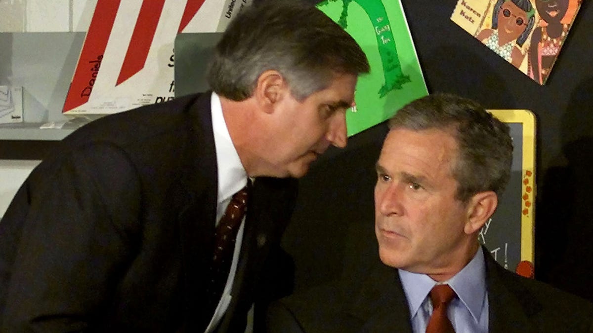 President George W. Bush listening to White House Chief of Staff Andrew Card at Emma E. Booker Elementary School