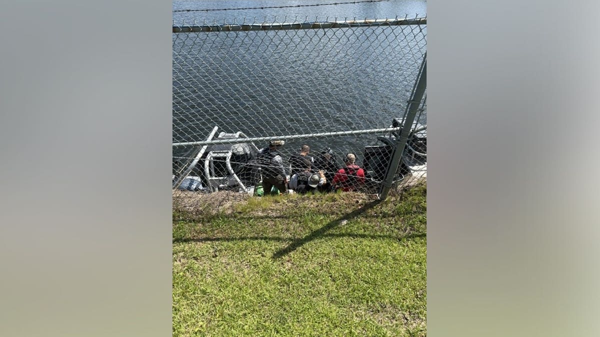 An inter-agency team in Alabama assesses an IED at the Converse Reservoir Dam in Mobile, Alabama.