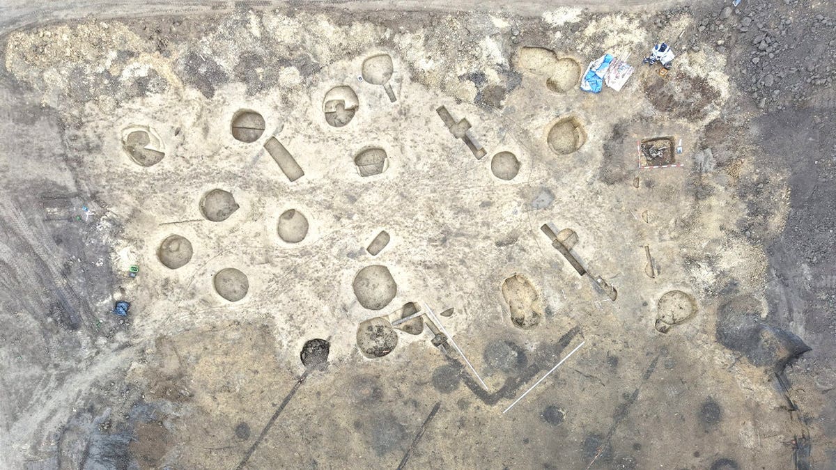 Aerial birds eye view of construction site with various pits