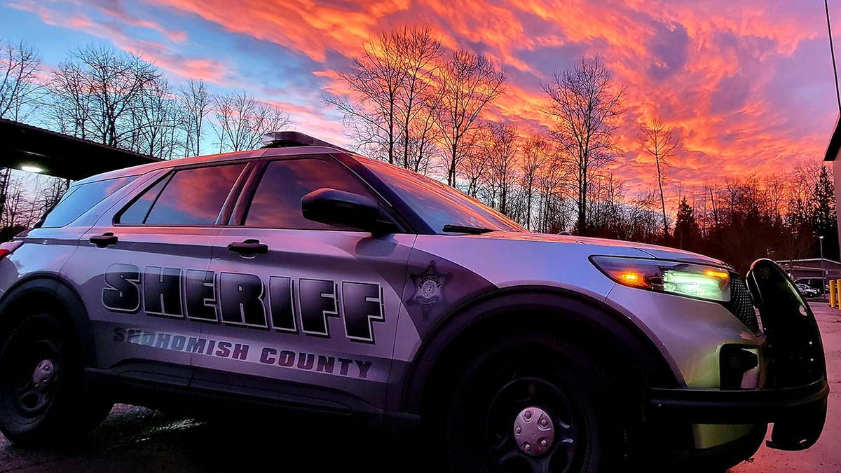 A Snohomish County Sheriff's Office vehicle parked at sunset.