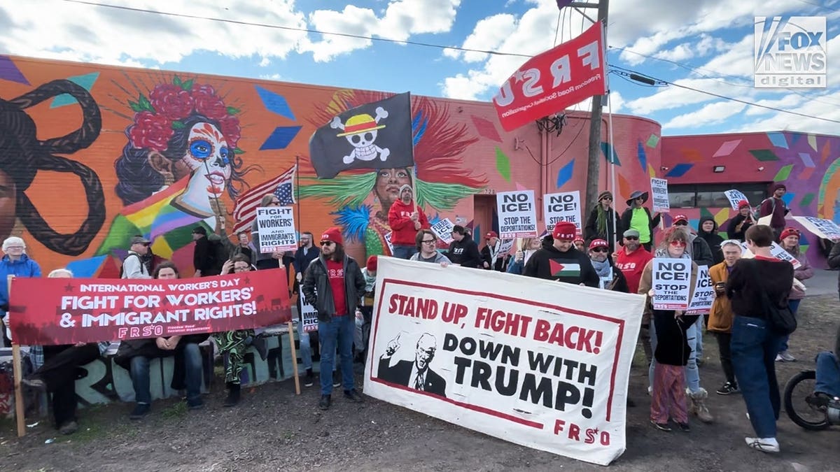 Protesters holding FRSO banners and signs at Minneapolis May Day rally