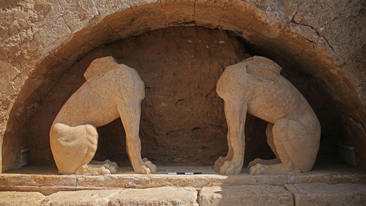 Destroyed carving of lions at site