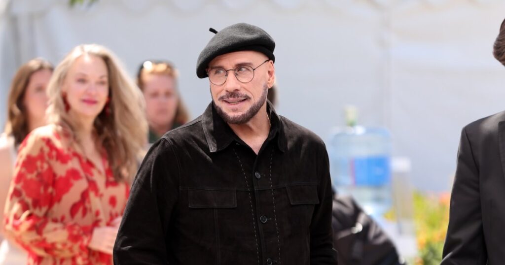 John Travolta Addresses Viral Cannes Look With Beret and Glasses: ‘Going to Play the Part’