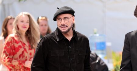 John Travolta Addresses Viral Cannes Look With Beret and Glasses: ‘Going to Play the Part’