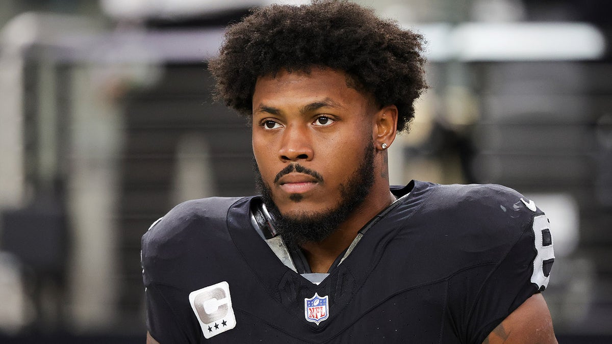 Running back Josh Jacobs of the Las Vegas Raiders standing during the national anthem at Allegiant Stadium