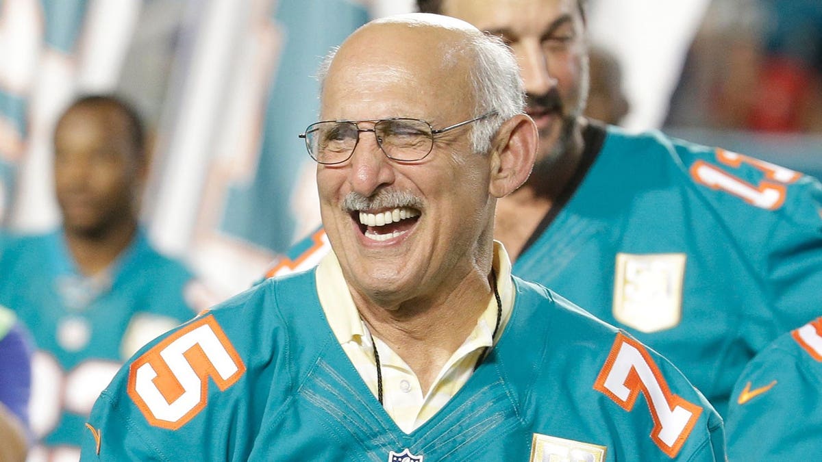 Former Miami Dolphins player Manny Fernandez smiling during halftime ceremony