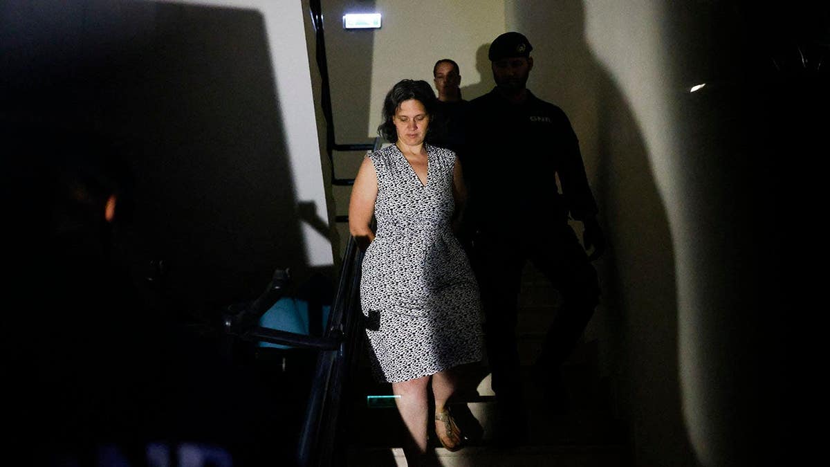 Marine Rousseau being arrested