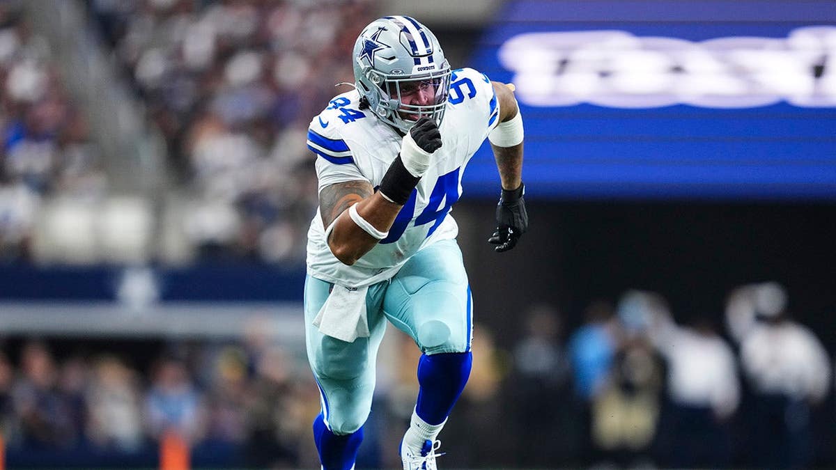 Marshawn Kneeland rushing the passer during an NFL game