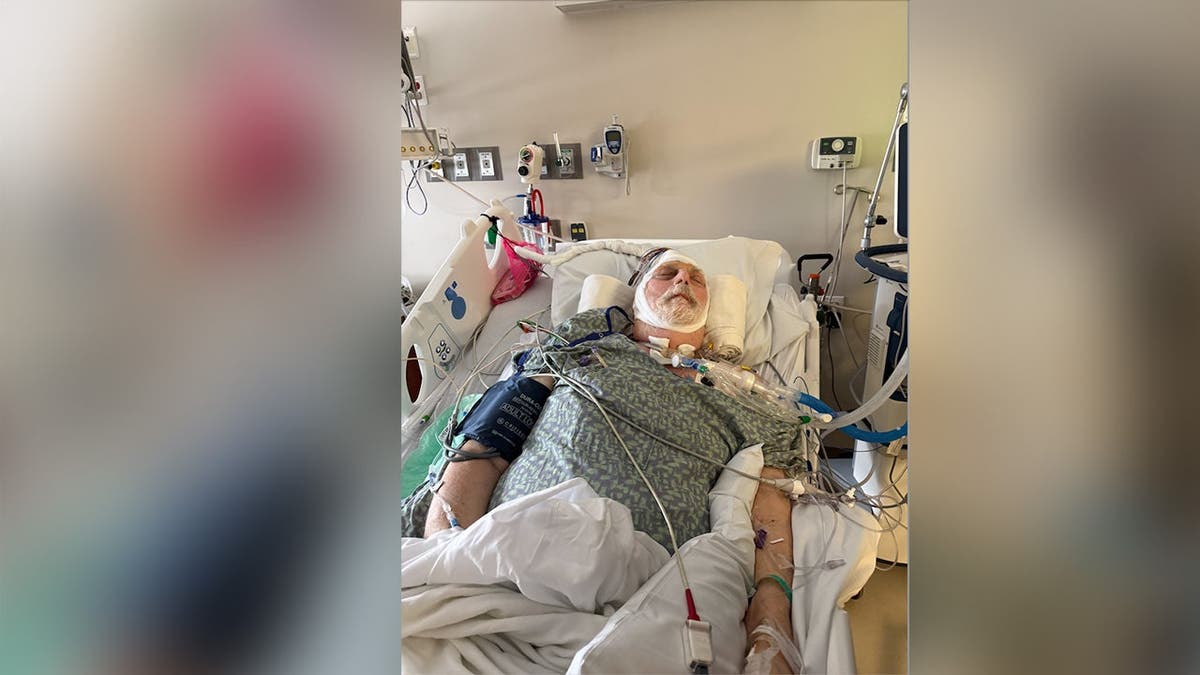 Lloyd Poole seen in a hospital bed
