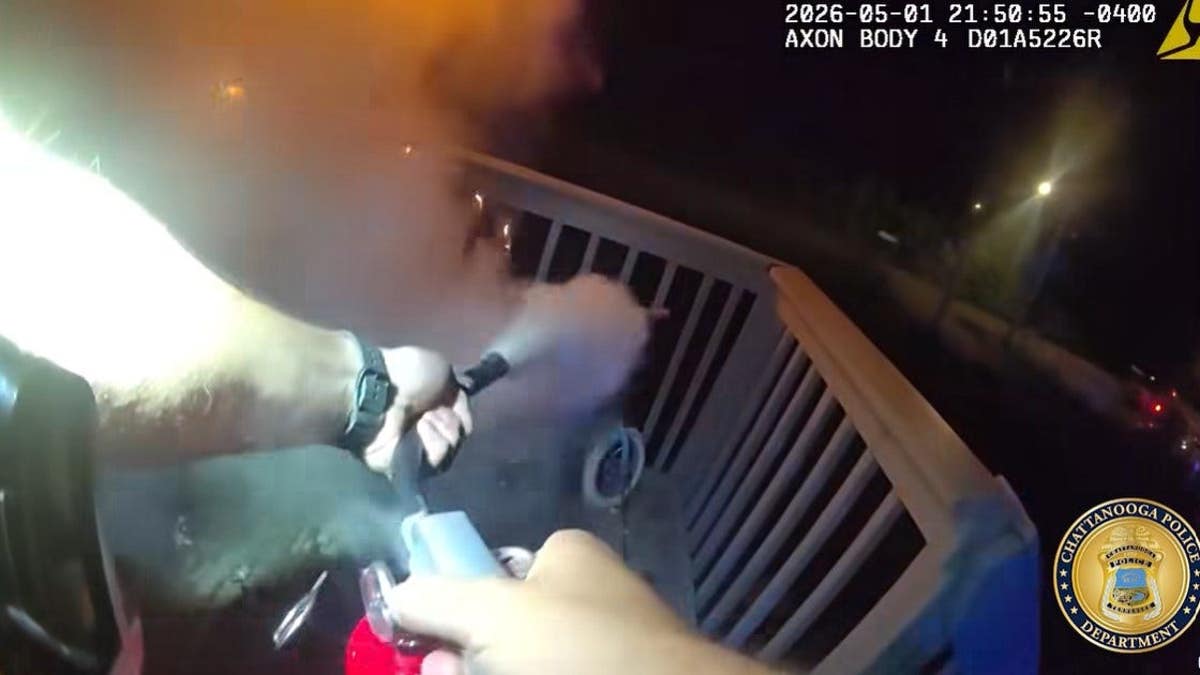 Chattanooga Police Department bodycam footage shows the arm of an officer trying to put out flames.