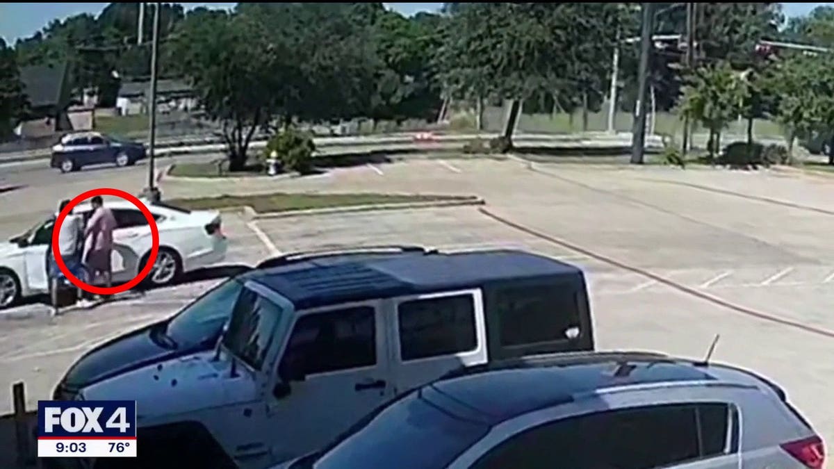 Video showed the man attempting to pull the father out of his car.