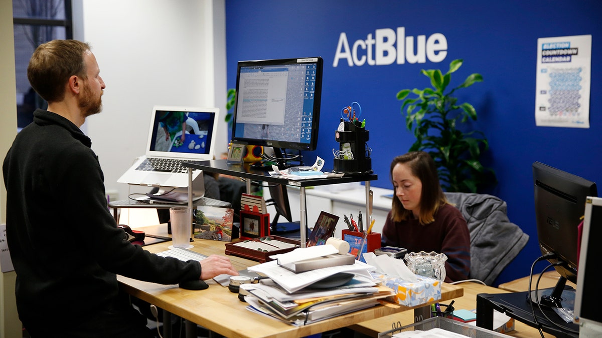 Exterior view of ActBlue offices building with glass windows and signage.