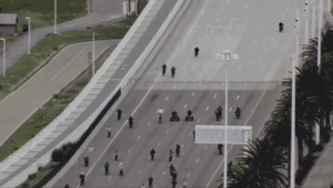 Video shows bridge turn into burnout bonanza in stunt-happy takeover – police swoop in to cuff road rebels
