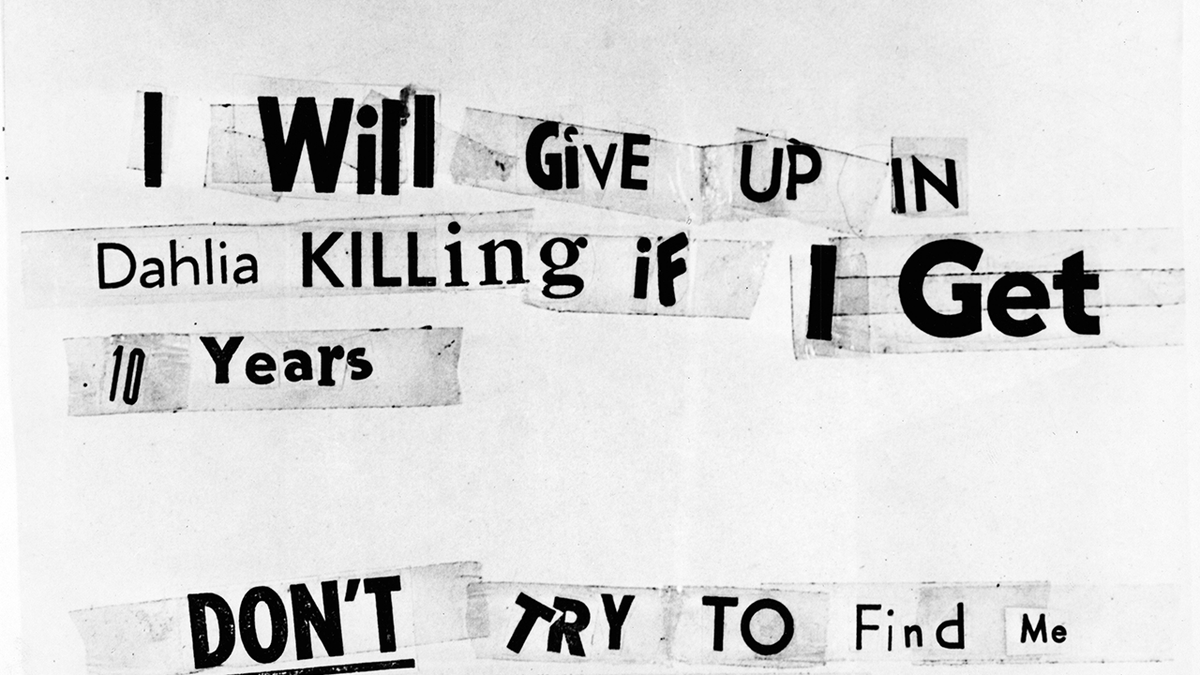 A black and white photo showing a note written with newspaper clippings that says 
