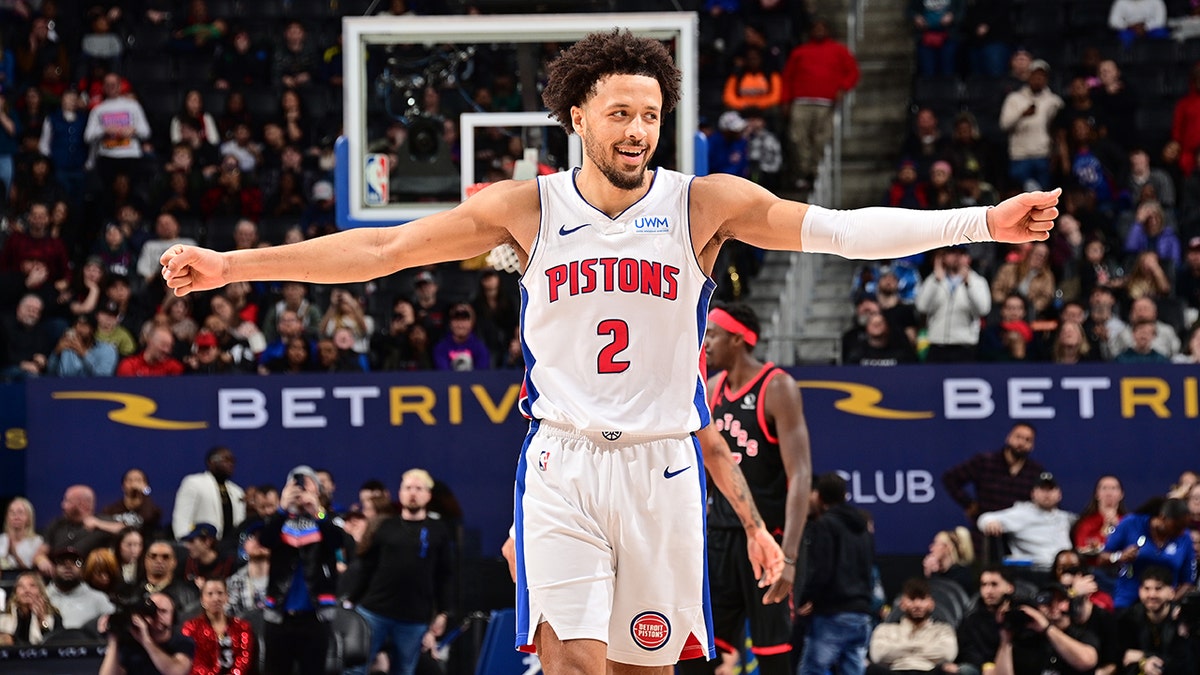 Cade Cunningham smiling after a basketball game at Little Caesars Arena in Detroit