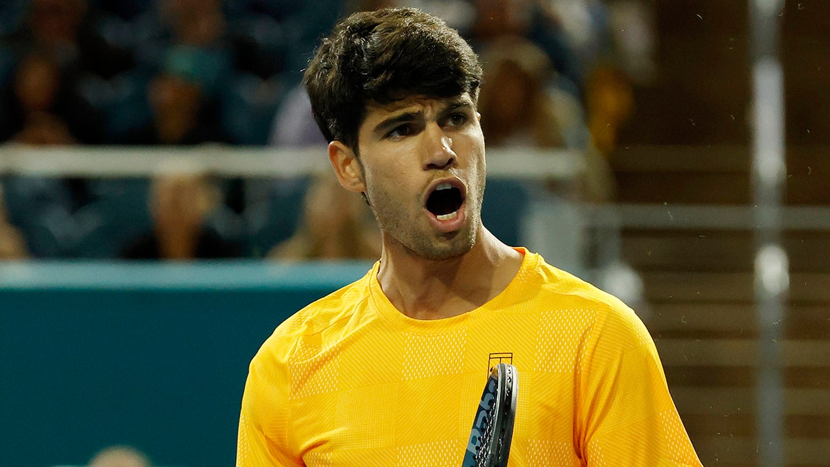Carlos Alcaraz reacting after winning a point at the Miami Open tennis tournament