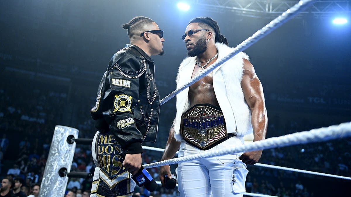 Carmelo Hayes and Trick Williams facing off in a wrestling ring