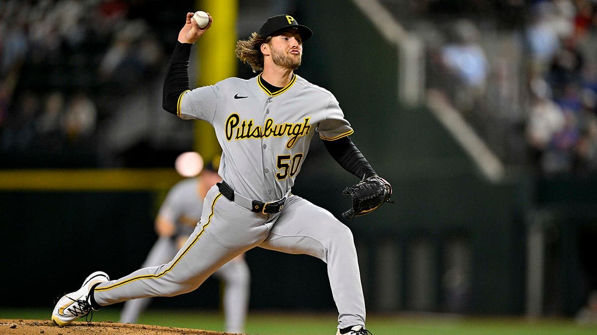 Pittsburgh Pirates pitcher Carmen Mlodzinski throwing a pitch at Globe Life Field