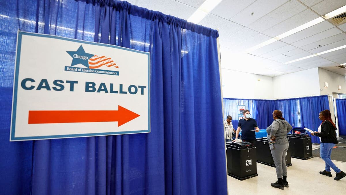 Voters casting ballots at early voting site