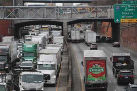 Debris rains onto NYC highway, injuring 1 and causing traffic nightmare