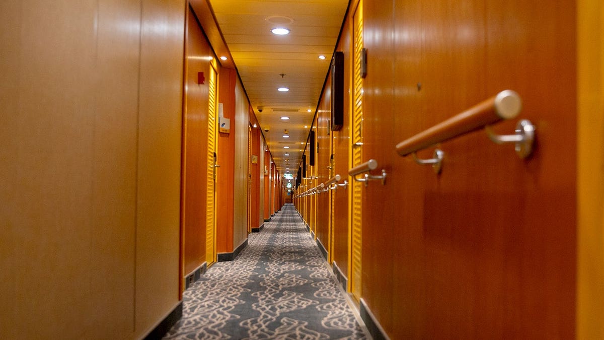 Hallway leading to sleeping quarters on a cruise ship