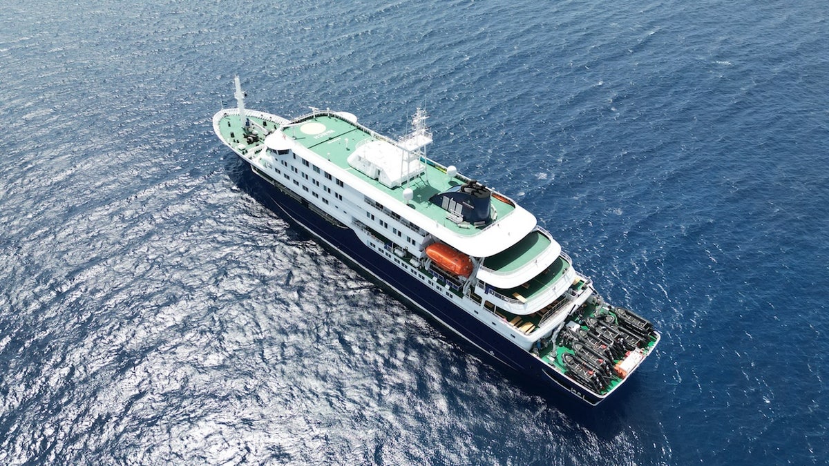 The cruise ship MV Hondius stationary off the port of Praia in Cape Verde