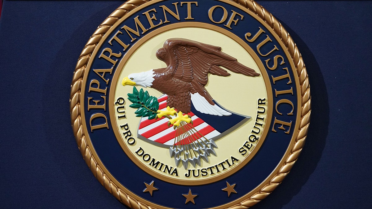 Department of Justice seal on lectern at press conference