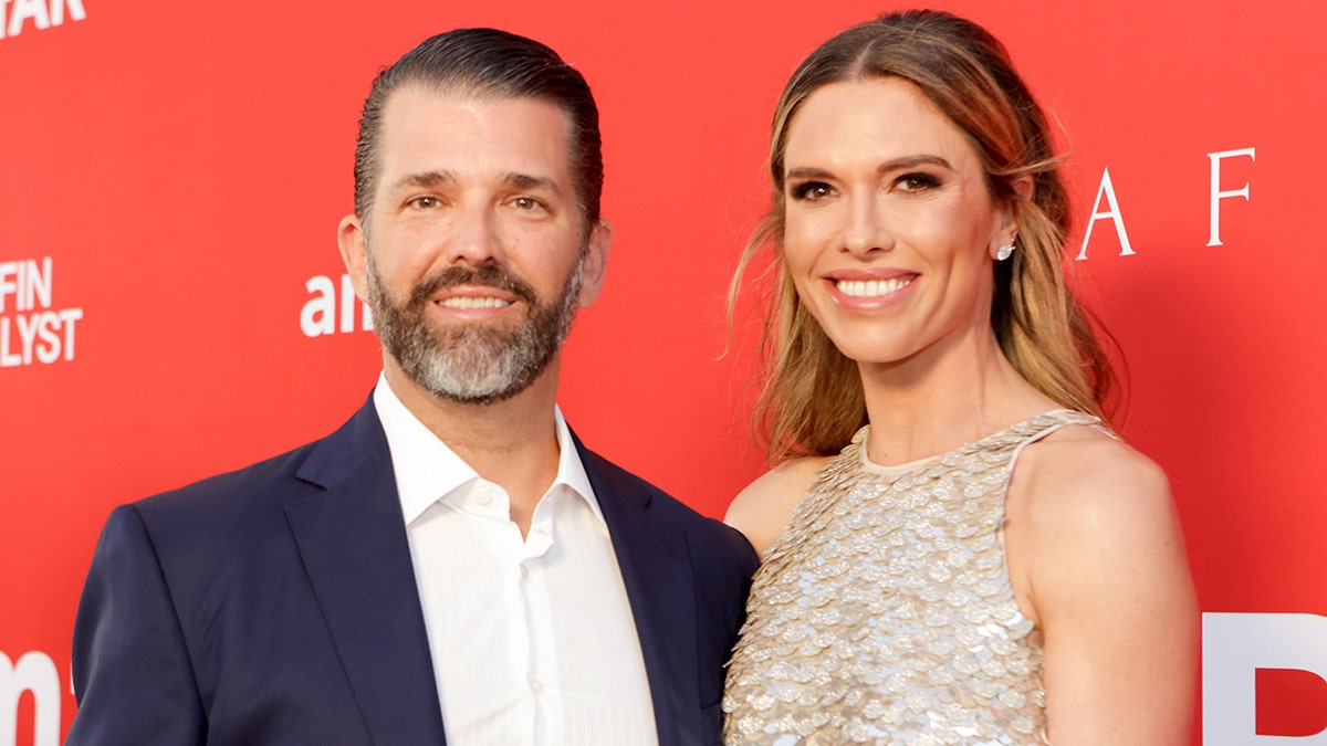 Donald Trump Jr. and Bettina Anderson standing together at an event.