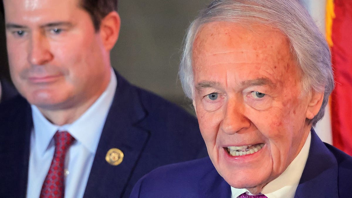 Senator Ed Markey speaking with Congressman Seth Moulton behind him at a church in Boston