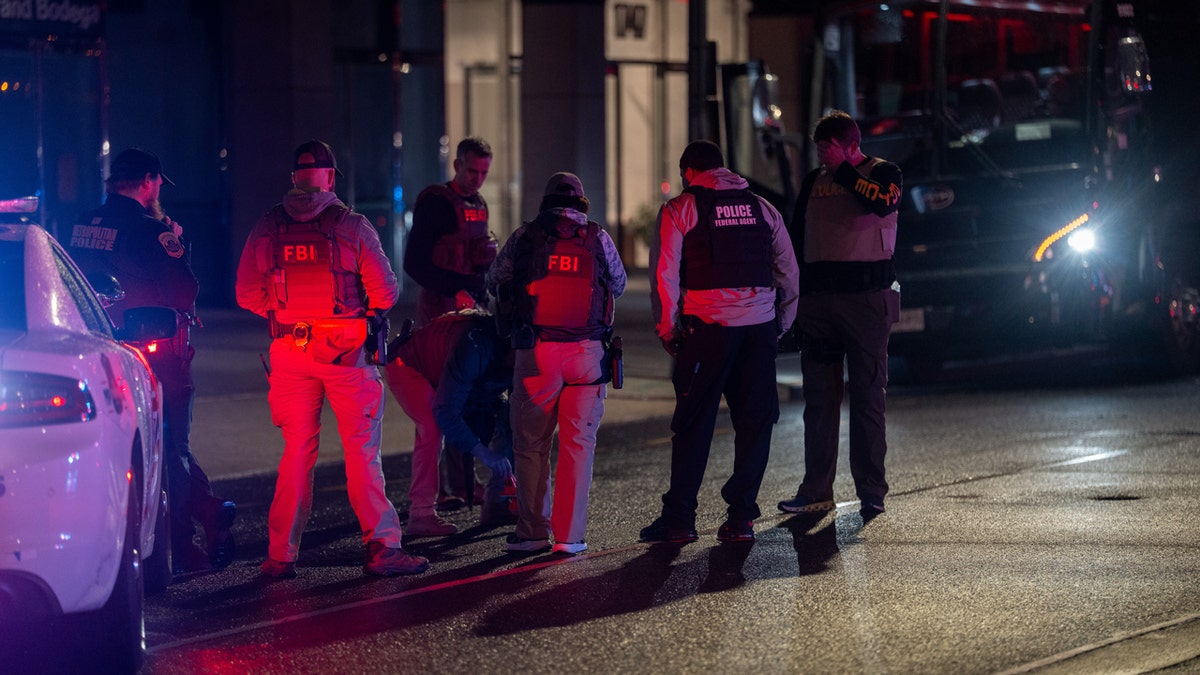 FBI and federal law enforcement agents standing near the White House in Washington, D.C.