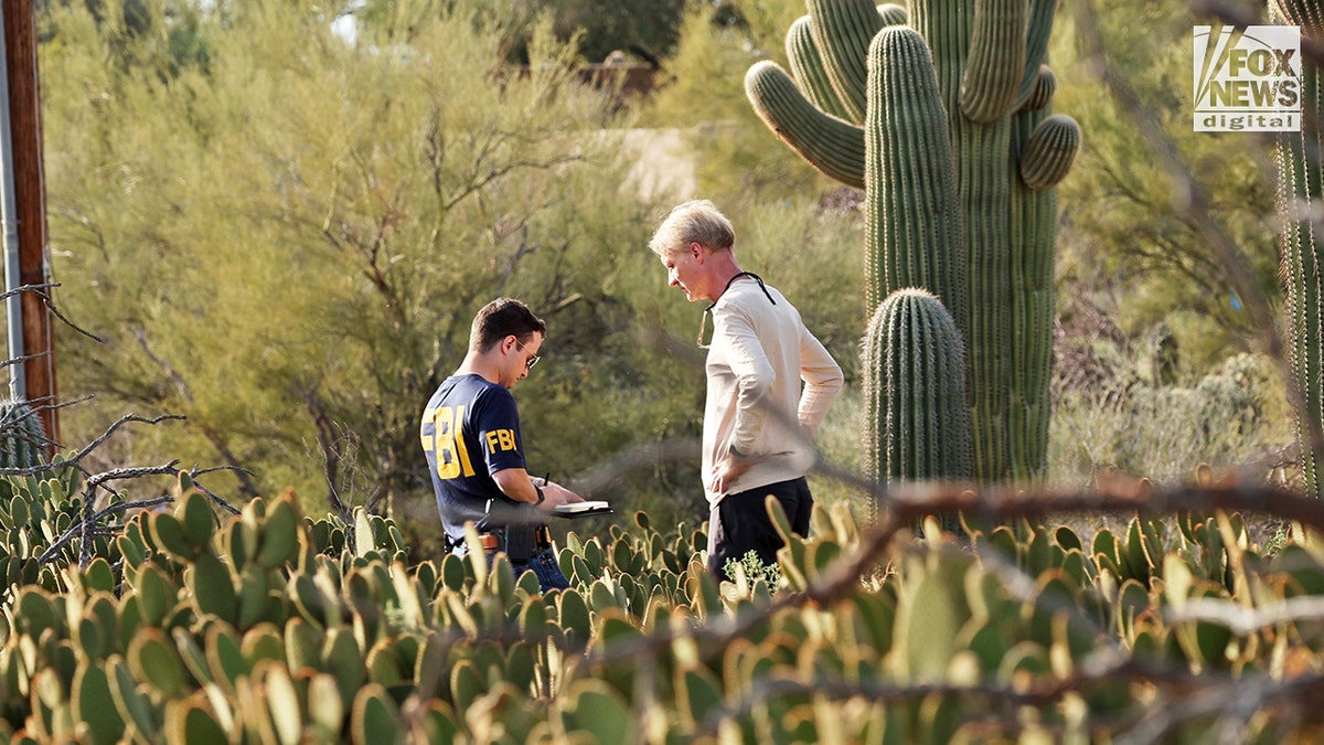 FBI agents searching behind Nancy Guthrie's home in Tucson