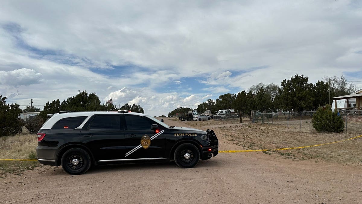 A New Mexico State Police vehicle blocks off a neighborhood in Mountainair, New Mexico
