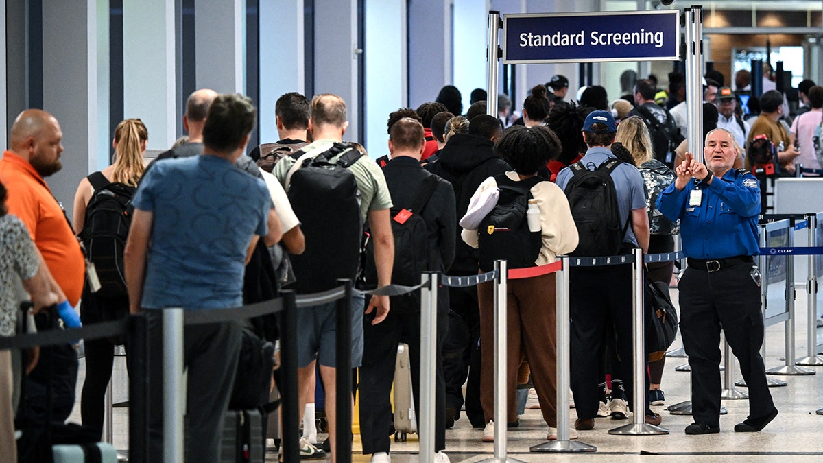 Travelers waiting in long security lines at George Bush Intercontinental Airport in Houston Texas