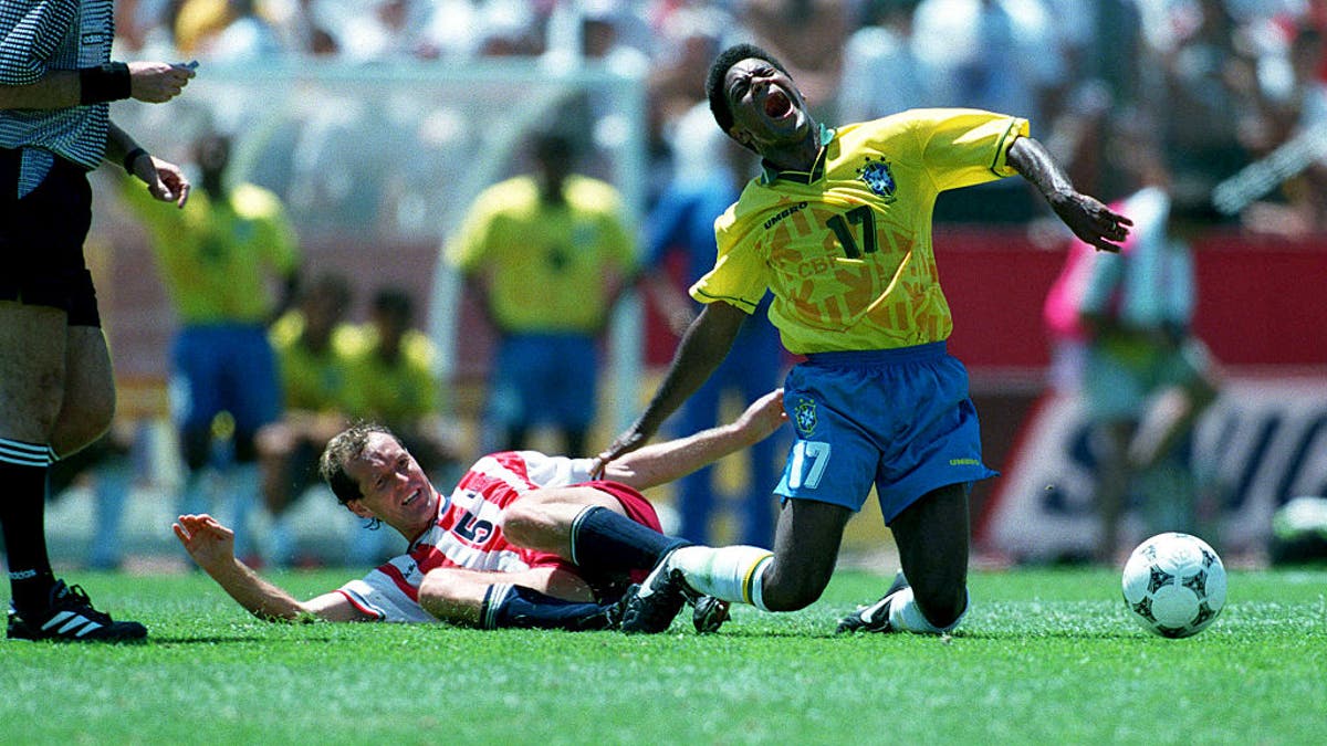 Thomas Dooley of United States and Mazinho of Brazil challenge during a World Cup match in 1994. (Photo by Stewart Kendall/Sportsphoto/Allstar via Getty Images)