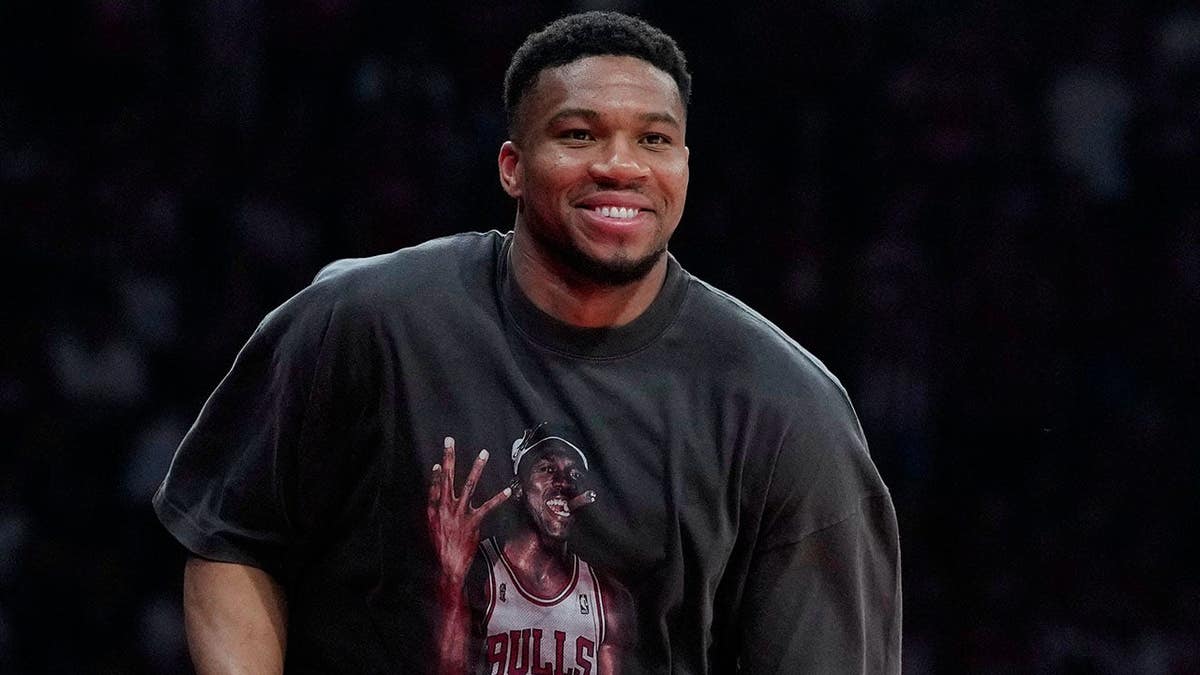 Giannis Antetokounmpo walking courtside at a EuroLeague playoffs basketball game